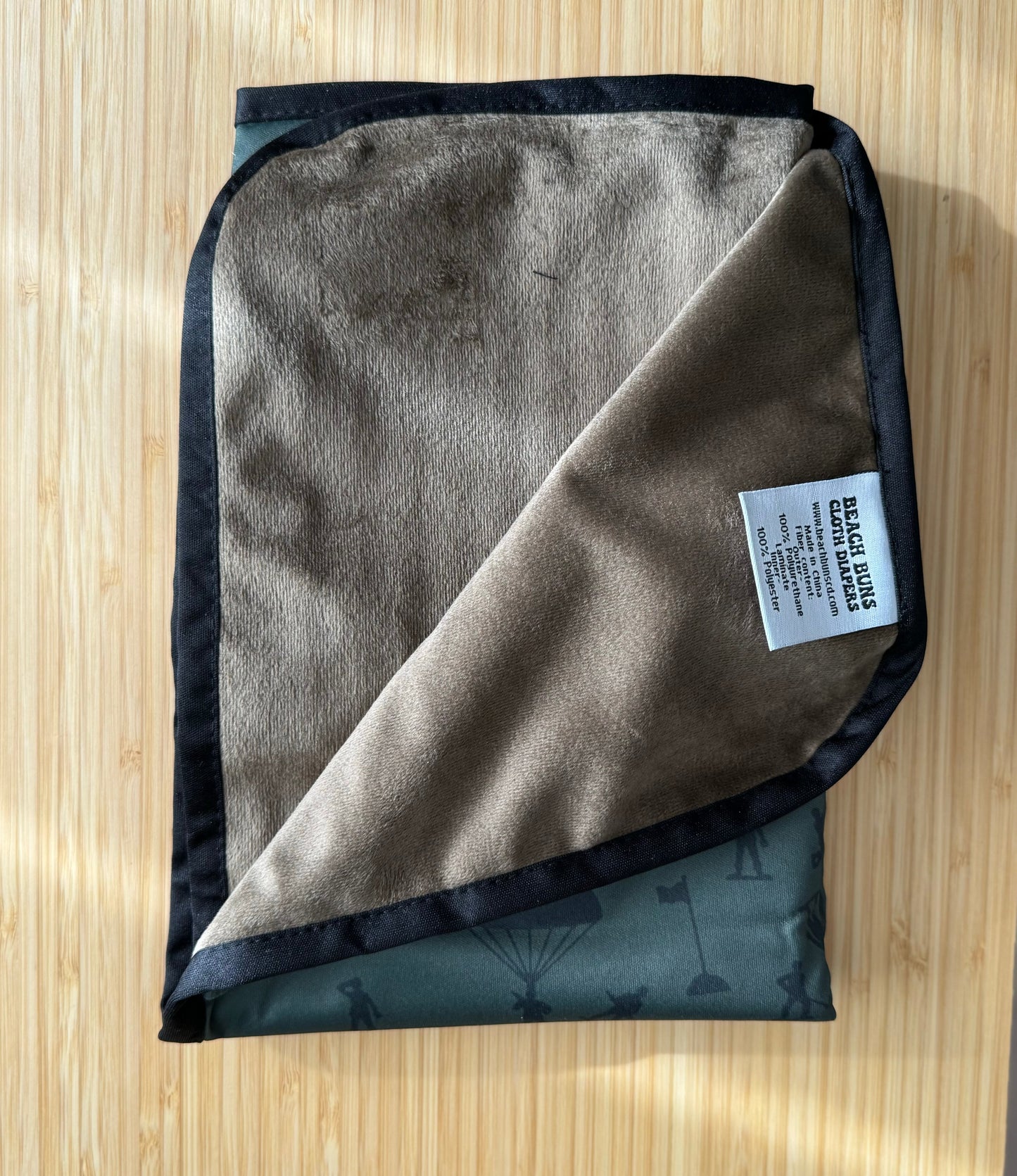 An assortment of colorful cloth diapers neatly stacked, showcasing a sustainable and eco-friendly diapering option for babies. The diapers display various vibrant patterns and soft fabrics, providing a reusable and comfortable solution for families.